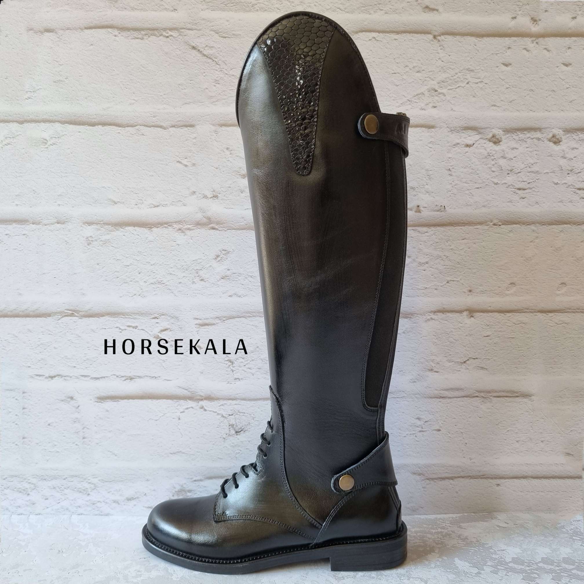 Woman riding tall boot
